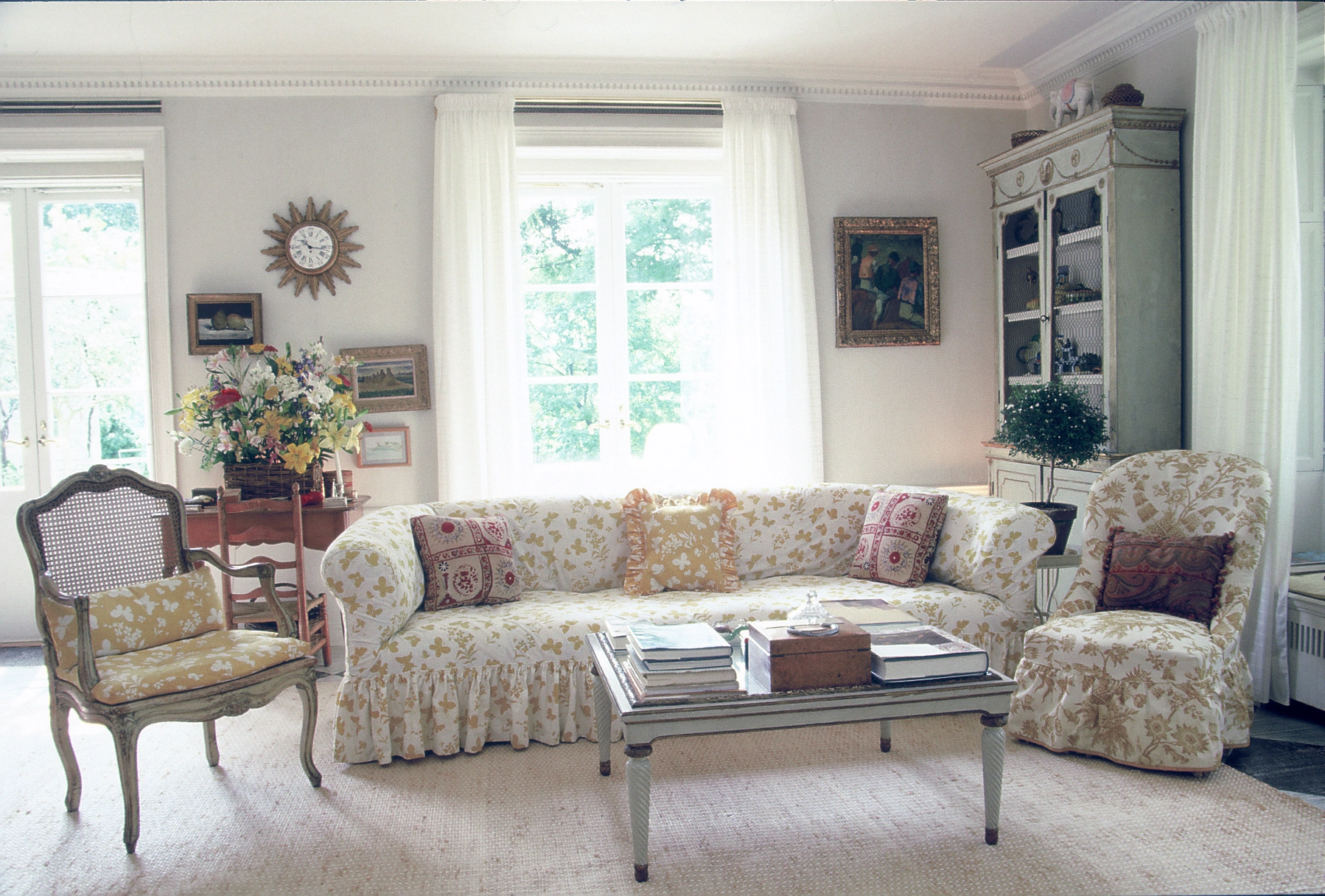 Sunlit interior with hand-printed textiles and classic furnishings